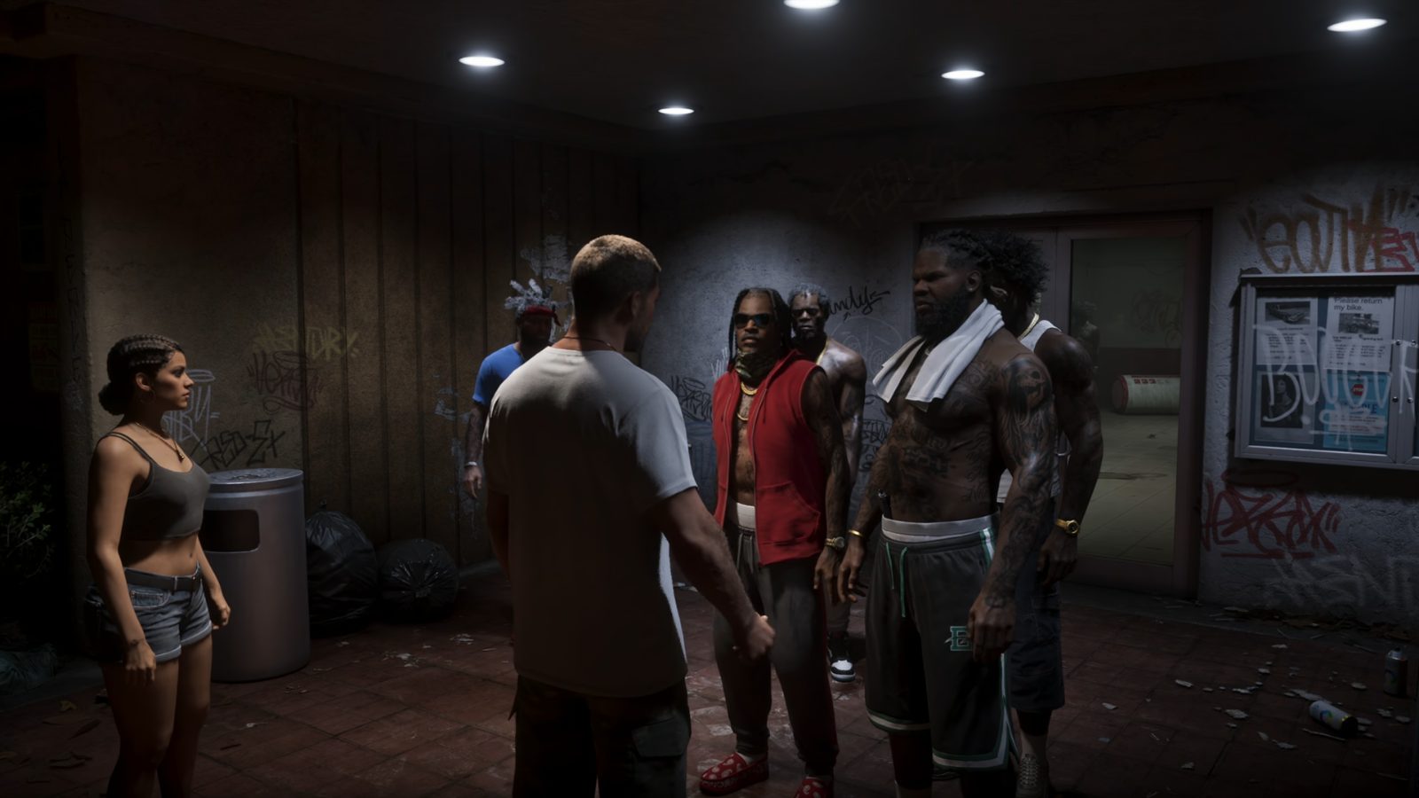 Jason e Lucia conversando com um grupo de homens dentro de um prédio em GTA VI.